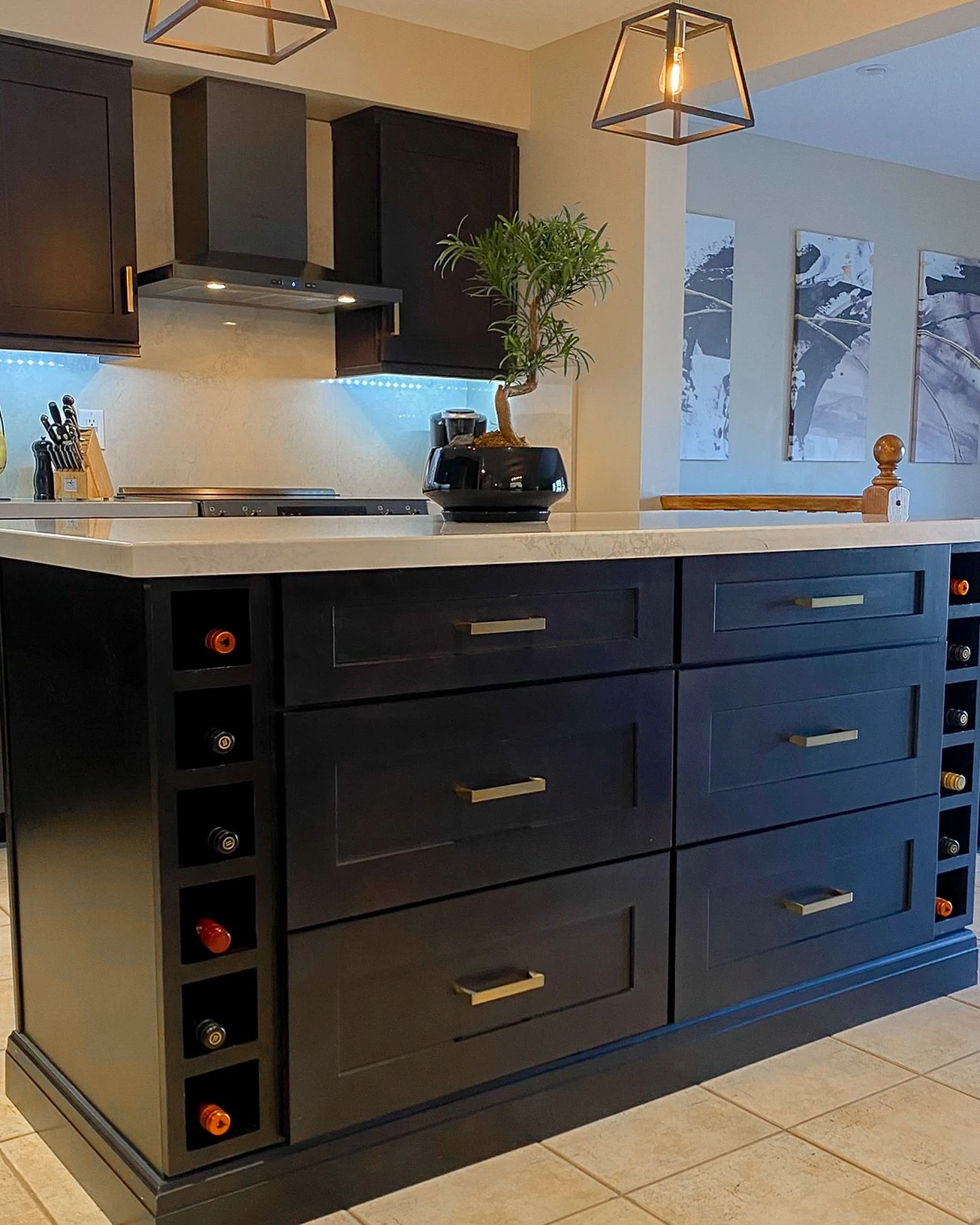 Kitchen with dark blue lower cabinets and warm wood upper cabinets