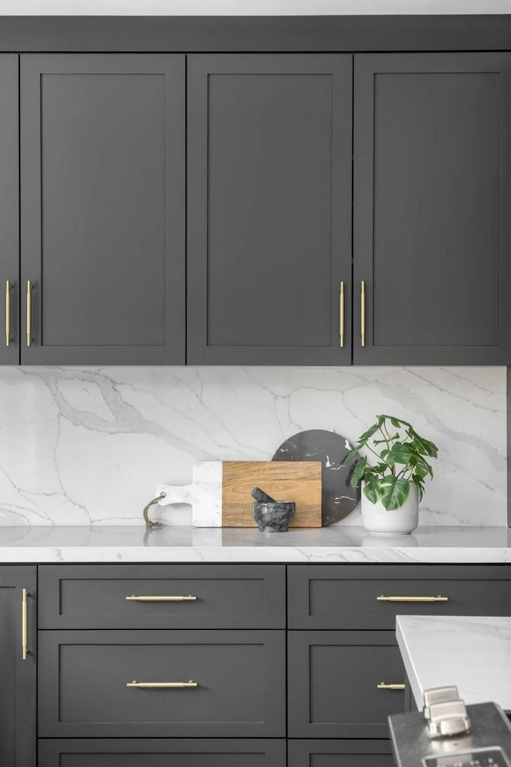 Light grey cabinets with open shelves and countertop display