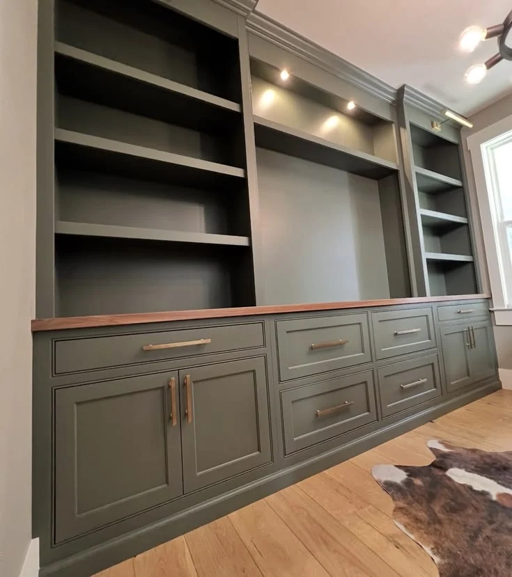 Floor-to-ceiling built-in wood bookcase and media storage