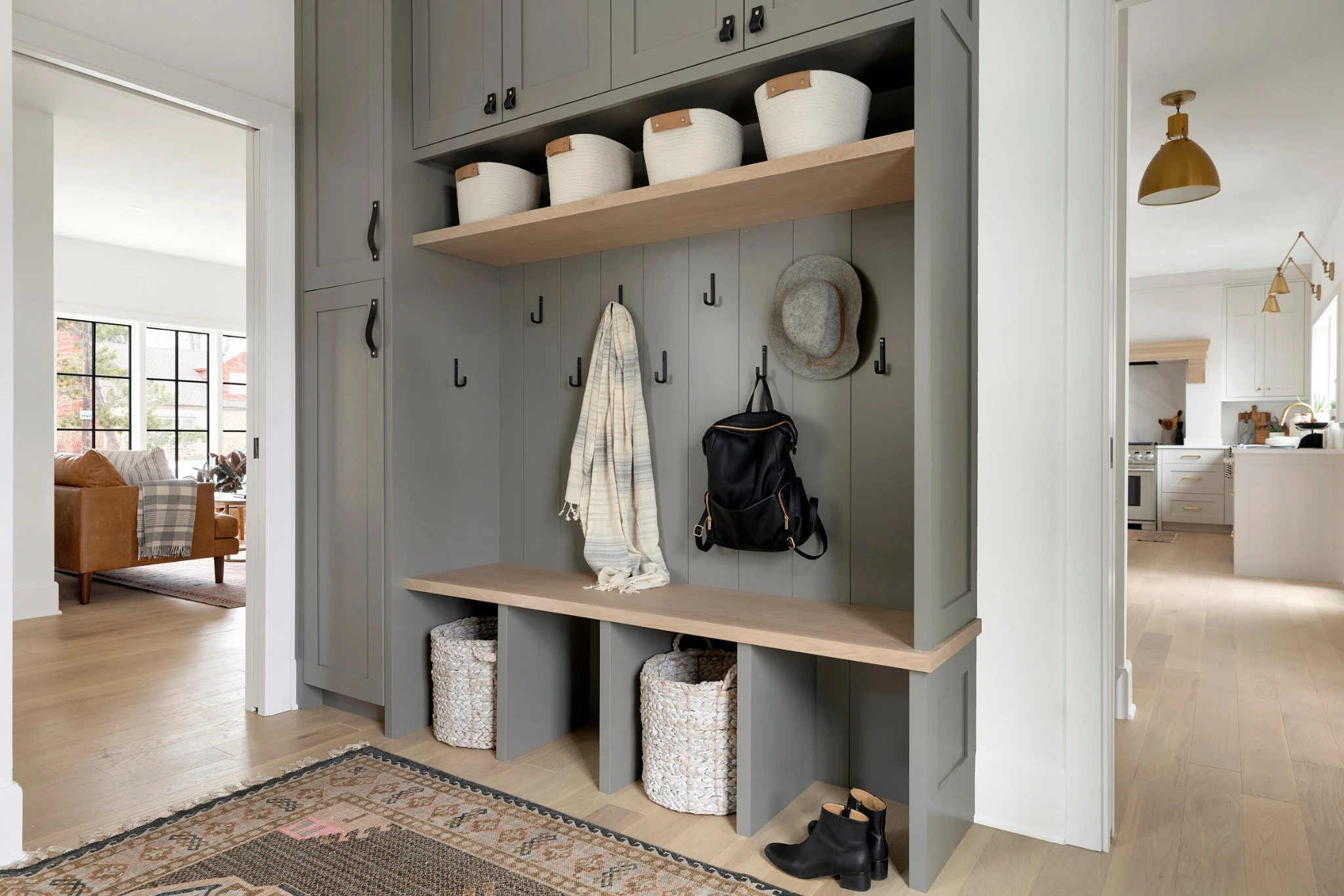 Built-in hallway wall cabinets and open coat storage