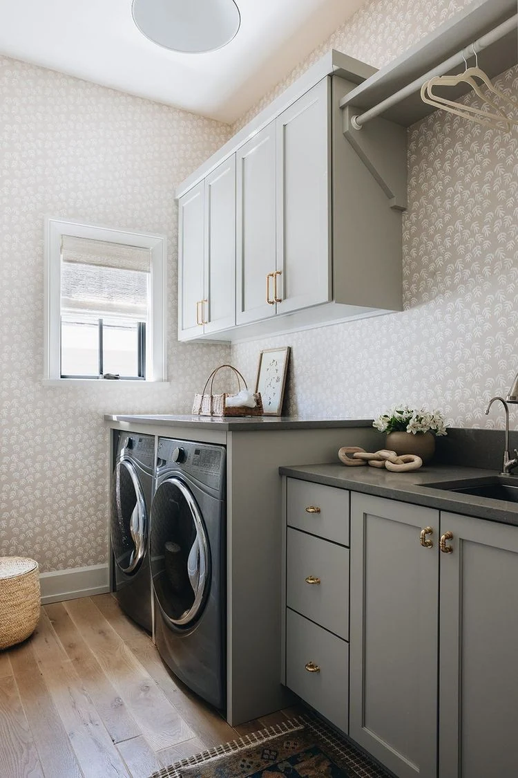 Laundry room with floor cabinets, washer and upper storage
